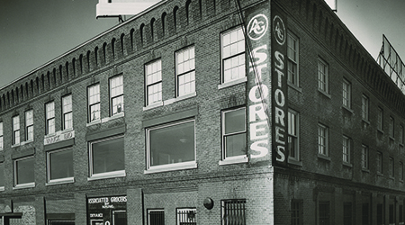 Black and white photo of an old AGNE storefront.